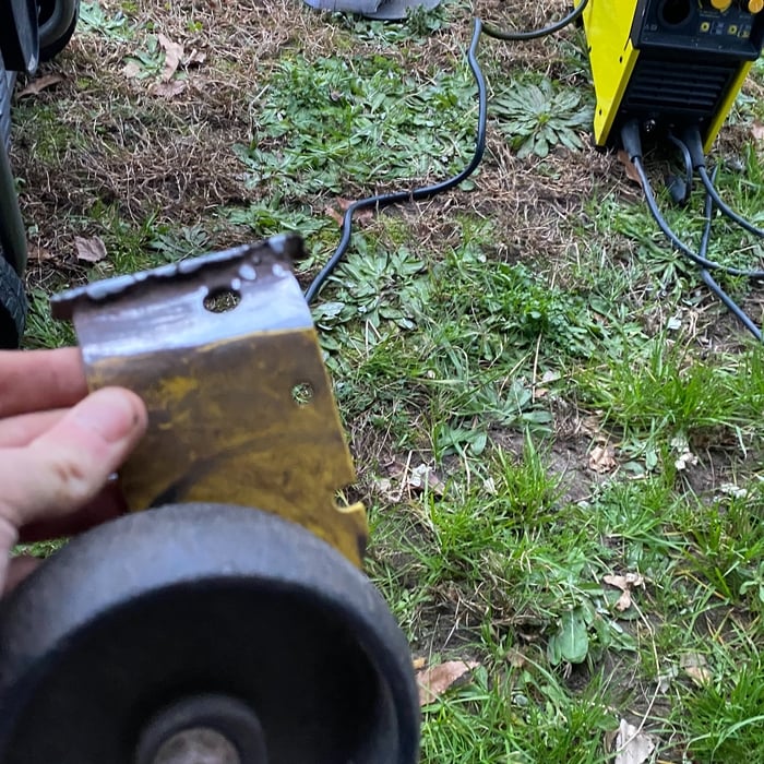 The wheel and bracket that fell off.
