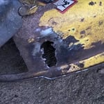 Where the wheel fell off the deck and I grinded it down and the rust around it off.