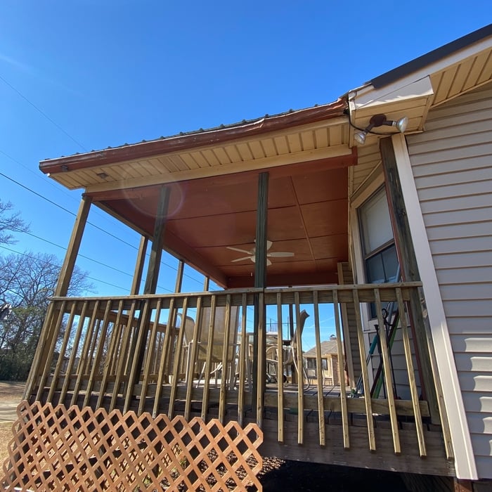 Old gutter on back side of porch, no downspout