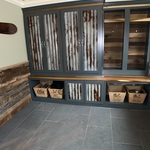 Acid edged galvanized metal to give it an old look. Cabinets are built at Poplar stained natural..