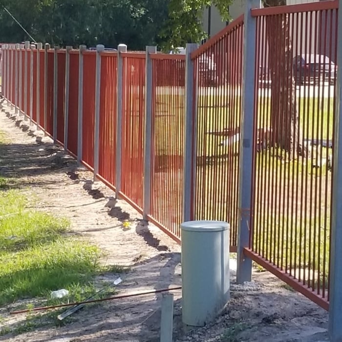 Process of installing the metal fence. Having to go up and down the grades of the land!