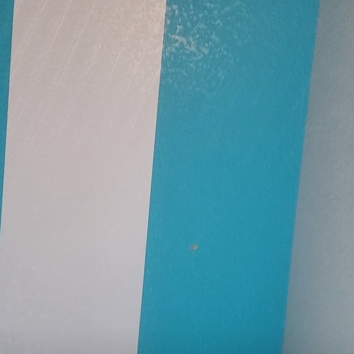 Aqua colored room getting painted.