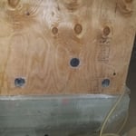 Venting in plywood with mesh screens.