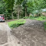 Half drive removed and topsoil installed.