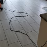 Subfloor replacement, tiling, interior painting, and light trim work