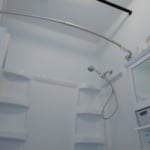 Installed a new tub and shower enclosure, added a more modern curtain rod and put some much needed paint on the ceiling and on the fire pipe running through the center of the room.