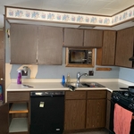 Empty all cabinets, wipe them out, & plan for the use of each cabinet per the flow of the client in the space.