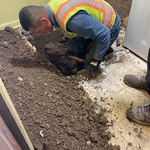 Exposing pipe to remove existing pipe and to run new 3 inch pvc pipe under foundation wall
