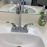 Another newly installed Colony Pro two handle faucet and Aqualyn White counter top bathroom sink at Our Savior Lutheran Church and School