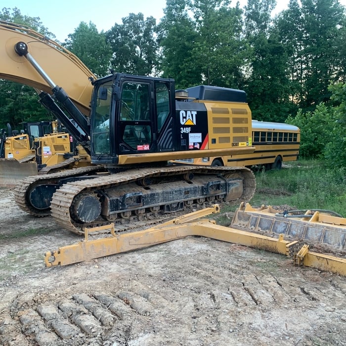 Power wash heavy equipment