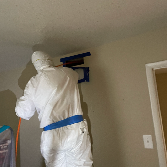 Begin cleaning duct with antimicrobial cleaner, whips, and negative air machine