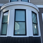 Restoration of old radius window & siding update