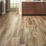 Beautiful hardwood flooring going from the living to the kitchen