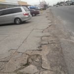 Damage asphalt that the client had before Melendez Construction added it touch of profession
