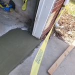 Patch work on a garage floor.
