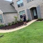 My happy customer after he saw the after results , he loved the landscape project we completed