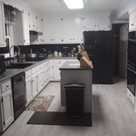 See the transition from the wood look to the white on the cabinets