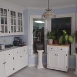 See the transition of the painted walls to the white cabinets to the new floor after picture