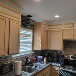Custom trim addition to bring cabinets to ceilings