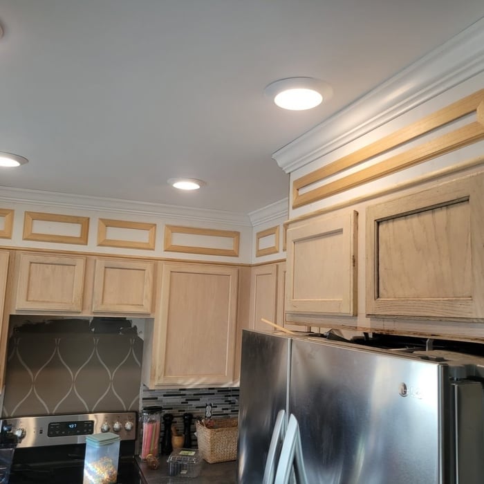 Custom trim addition to bring cabinets to ceilings