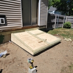 Wooden bulkhead with door and wooden latch
