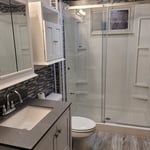 Everything was New that we installed. Was not a fan in how they wanted there Mirror and cabinet hung, but they loved it! Light fixture on ceiling was not done by us.