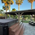 Wood custom stairs and bench around hot tub