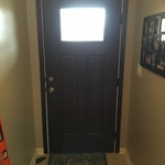 Door install with trim and screen door.