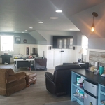 Picture from entrance, notice the custom paneling on walls and repurposed barn wood on wet bar. The customer wanted a craftsman feel in this space. I think this turned out great!