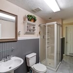 Before Pic. Customer purchased home that had an already finished basement but had the need to redesign layout for more living space and update finishes.