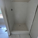 Custom walk in shower with porcelain tile