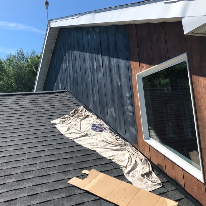 finished roof and painting exterior of house