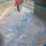 Placing bond kote prior plastering