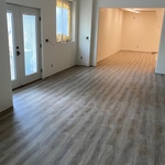 Glue down LVP over self leveling underlayment.