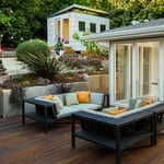 Glass wall into living room open to merge indoor/outdoor space!