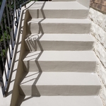 This is a view of the finished steps. After grinding off all of the damaged material, all repairs were made and then the entire area was resurfaced and sealed.