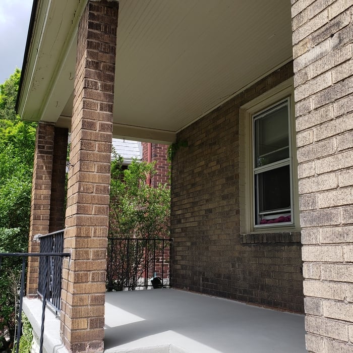 A view of the porch upon completion, after repairs, resurfacing and sealing.