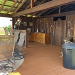 removed wind damaged metal roof and re-stained interior of pool house
