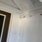 The ceiling was unpainted. The old paint had to be scraped away, and repainted.