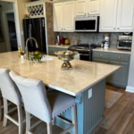 Behold the centerpiece of luxury and functionality in the Larryson family's kitchen remodel by Alta Renovations. The meticulously crafted island stands as a testament to elegance and innovation, boasting exquisite marble countertops and custom modifications. With extended seating and integrated storage solutions, this island is not just a visual delight but also a versatile hub for culinary creativity and social gatherings.