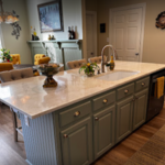 Marvel at the centerpiece of sophistication in the Larryson family's newly remodeled kitchen. Alta Renovations' expert craftsmanship shines through in the exquisite marble-topped island, a symbol of elegance and functionality. With its seamlessly integrated modifications and extended seating, this island invites gathering, cooking, and making memories in style.