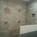 Custom shower. Converted from a fiberglass shower and toilet room, to a double sized walk-in shower with a rain head in the ceiling and custom soap boxes.