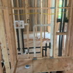 Roughed in a laundry box and floor drain for washing machine. Floor drain for an emergency flood