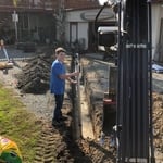 Trench line from low point at garage to holding tank