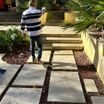 Discussing back yard pool area and landscape design with homeowner