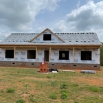 Setting shingles on roof