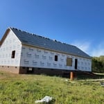 Setting shingles on roof