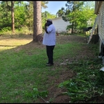 Rear side of building after tall grass and weeds are cut and property line has been cleared of small trees and shrubs.