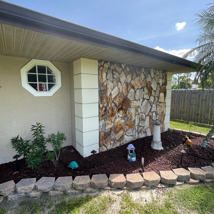 REMOVE STONE VENEER AND APPLY STUCCO