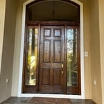 Applied a new coat of stain and sealant to the main entrance. Turned out perfect